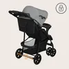 A rear view of a gray and black baby stroller. Podgląd zdjęcia produktu