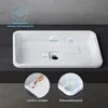 A white rectangular sink is shown with various labels and diagrams highlighting its features. Anteprima dell’immagine prodotto