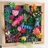 A framed artwork made of colorful modeling clay, depicting various whimsical creatures and floral elements. Náhled obrázku produktu