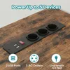 A close-up view of a power strip integrated into a wooden desk surface, showing USB ports, AC outlets, and a power switch. Anteprima dell’immagine prodotto
