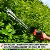 A person is using a red and silver hedge trimmer to trim a green hedge. Produktbild-Vorschau
