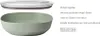 A green salad bowl with a clear lid, presented with descriptive text and icons. Produktbild-Vorschau