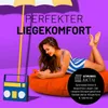 A woman is lying on an orange beanbag, using her phone, with a beach umbrella and a toy radio in the background. Voir les images du produit