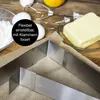 Baking ingredients and a cake ring on a wooden surface. Anteprima dell’immagine prodotto