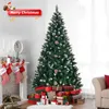 A decorated Christmas tree with presents underneath, stockings hung on a fireplace, and a "Merry Christmas" banner. Anteprima dell’immagine prodotto
