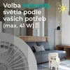 A room with a sofa, a floor lamp, and a fan in the foreground with text overlay. Náhled obrázku produktu