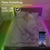 A person sleeping in a bed with RGB LED strip lights illuminating the room and a smartphone displaying app controls. Náhľad obrázku produktu