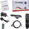 A collection of items for a digital satellite receiver, including the box, manual, power adapter, cables, remote control, and batteries. Produktbild-Vorschau
