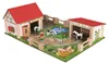 A toy farm playset with buildings, animals, and figures. Anteprima dell’immagine prodotto