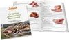 An open book with images and text about smoking food, with a cookbook cover in the foreground. Produktbild-Vorschau