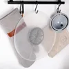 Kitchen accessories hanging on a rack. Produktbild-Vorschau