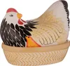 A ceramic hen-shaped lid sits on a basket-shaped base, with a small chick peeking out from under the hen. Náhled obrázku produktu