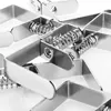 A close-up, black and white shot of several metal spring clamps arranged in a pattern on a white background. Produktbild-Vorschau