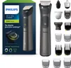The image shows the packaging of a Philips Multigroom Series 7000 trimmer, along with various attachments. The packaging features a prominent image of the trimmer and text describing its features. Produktbild-Vorschau