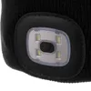 A close-up view of a black beanie hat with a built-in LED light. Produktbild-Vorschau