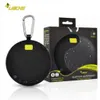 A product shot of a black portable Bluetooth speaker and its packaging. Produktbild-Vorschau