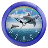 A close-up of a blue alarm clock with a dolphin and rainbow design. Produktbild-Vorschau