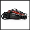 A red and black electric lawnmower is shown folded for storage, viewed from the side. Náhľad obrázku produktu