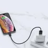 A smartphone is charging from a wall adapter plugged into a power strip. Anteprima dell’immagine prodotto