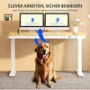 A golden retriever dog sits in front of a height-adjustable desk with two monitors, illustrating the product's functionality and safety features. Produktbild-Vorschau