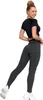 A woman wearing leggings and a crop top, posing against a white background. Produktbild-Vorschau