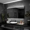 A modern bathroom vanity with a large LED-lit mirror, sink, and accessories. Produktbild-Vorschau