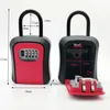 Two views of a black and red key safe with a combination lock, one closed and one open, with dimensions indicated. Anteprima dell’immagine prodotto
