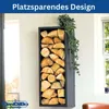 A black metal firewood rack mounted on a wall, filled with logs, with a plant hanging over it. Produktbild-Vorschau