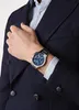 A man wearing a suit and watch. Náhľad obrázku produktu