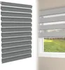 A close-up view of a gray zebra roller blind, with a second, partially transparent view of the blind installed on a window overlooking a grassy yard. Voir les images du produit