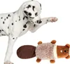 A Dalmatian dog is playing with a plush beaver toy. Anteprima dell’immagine prodotto