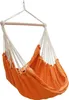 An orange fabric hammock chair suspended by white ropes from a wooden spreader bar. Podgląd zdjęcia produktu