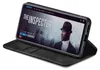 A black flip case for a smartphone is shown open, displaying a movie streaming interface on the phone screen. Produktbild-Vorschau