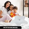 A family (mother and two children) sitting on a bed with a pillow in the foreground. Anteprima dell’immagine prodotto