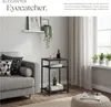 A side table in a living room setting next to a sofa. Produktbild-Vorschau
