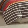 A close-up view of a striped duvet cover and pillowcase. Produktbild-Vorschau