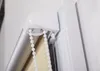 A close-up view of the mechanism and pull cords of a roller blind. Produktbild-Vorschau