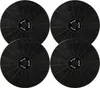 Four black circular charcoal filters arranged in a 2x2 grid. Produktbild-Vorschau