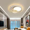 A modern living room with a ceiling light, sofa, and artwork. Náhled obrázku produktu