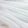A close-up, abstract view of white fabric with subtle text and patterns visible. Produktbild-Vorschau