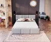 A bedroom with a bed, desk, and other furniture. Produktbild-Vorschau