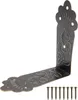 A single vintage-style corner bracket with decorative embossing and a set of nails, presented on a white background. Produktbild-Vorschau