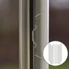 A close-up view of metal clips attached to the edge of a glass panel, with a circular inset showing a stack of the clips. Náhled obrázku produktu