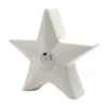 A white ceramic star-shaped LED light is shown from a side angle against a white background. Produktbild-Vorschau