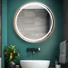 A modern bathroom vanity with a round LED mirror, sink, and faucet. Produktbild-Vorschau