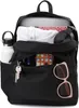 An open black Jansport backpack with various items inside, including a laptop, headphones, a water bottle, keys, sunglasses, and a smartphone. Náhľad obrázku produktu