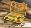 A DeWalt drill bit set is displayed on a surface with wood scraps and sawdust. Náhled obrázku produktu