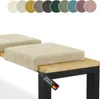 Two beige corduroy bench cushions on a wooden bench with a black metal frame. A tag is attached to the bench cushion. Náhled obrázku produktu