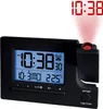A black digital projection alarm clock is shown against a white background. The clock displays the time, date, and temperature. A red projection of the time is visible on the upper right side of the image. Produktbild-Vorschau