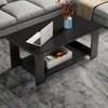 A black coffee table with a shelf is shown in a living room setting, with a sofa in the background. Produktbild-Vorschau